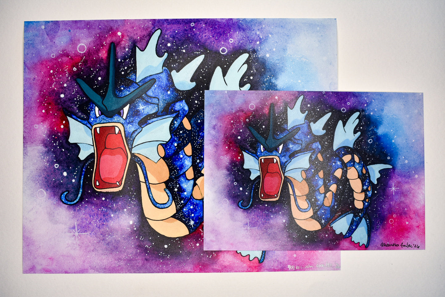 Two illustrations of a dragon-like creature with a colorful, galaxy-style background.