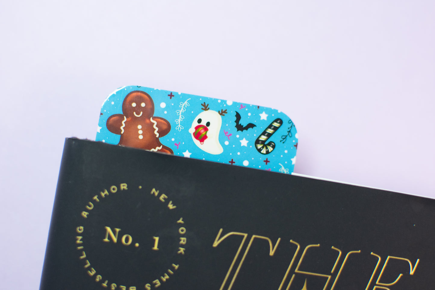 Christmas-themed bookmark in a book