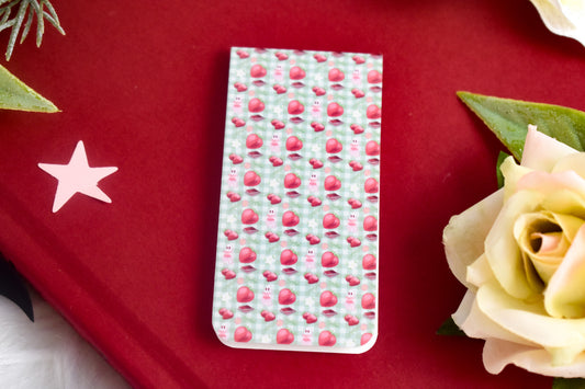 Patterned bookmark on a red book with a star and rose