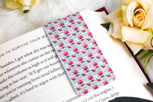 Bookmark with ghosts and strawberries on a book with flowers