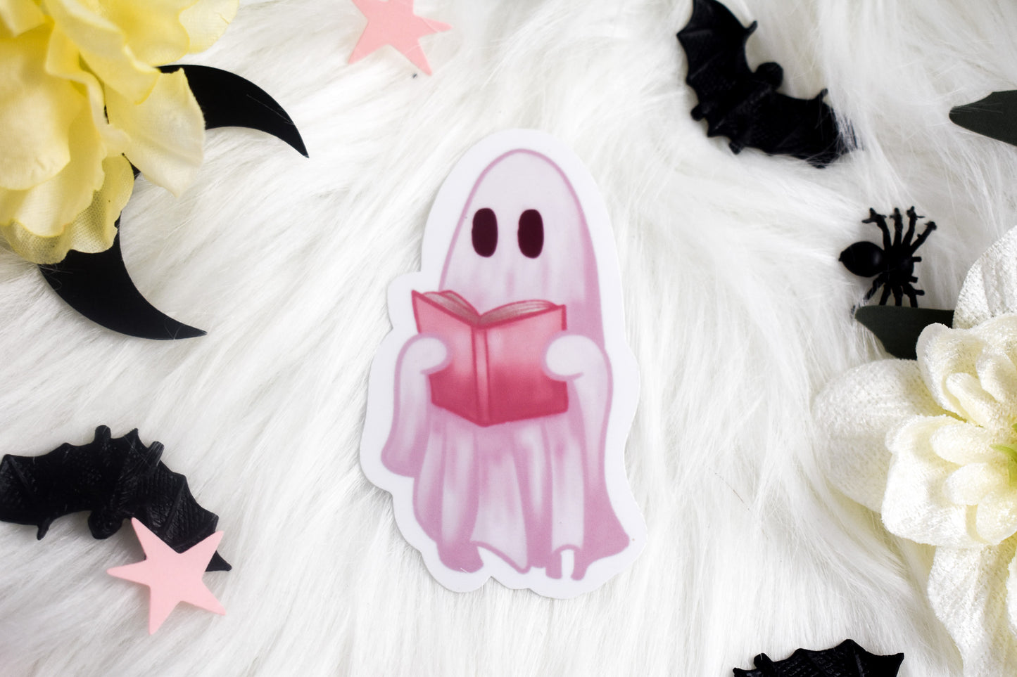 Ghost holding a book die-cut sticker
