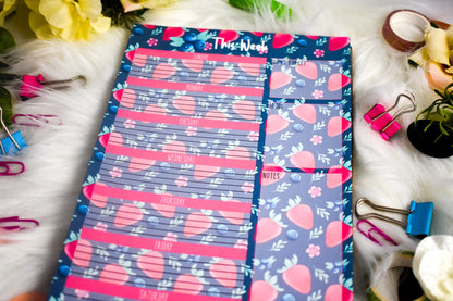 Weekly planner with strawberry designs on a floral background