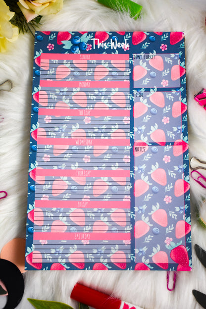 Weekly planner with strawberry designs on a floral background