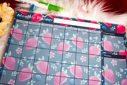 Monthly planner with strawberry pattern on a floral background