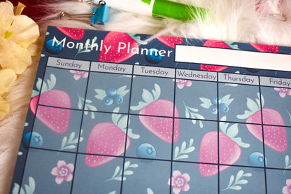 Monthly planner with strawberry design on a floral background