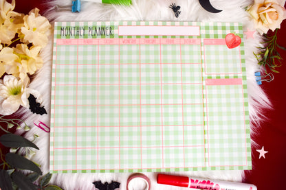 Monthly planner sheet with decorative elements on a floral background