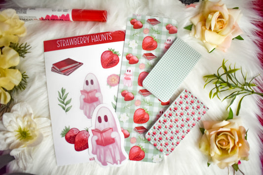 Die-cut sticker, ticker sheet, traditional bookmark and 2 magnetic bookmarks with strawberry and ghost designs on a white background