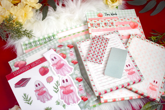 Stationery items including notepads, stickers, bookmarks, and planners on a red background with decorative elements.