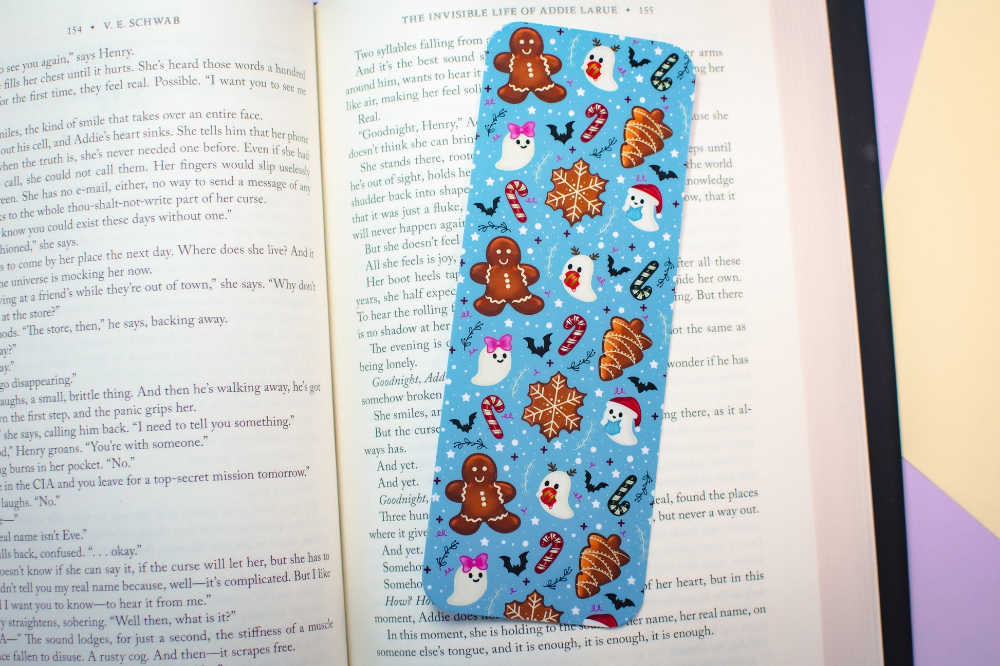 Bookmark with Christmas-themed designs on an open book