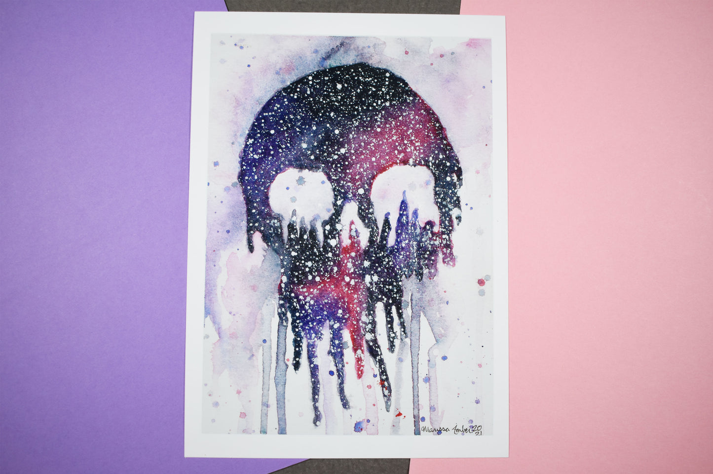 Watercolor painting of a skull with a colorful gradient on a white background