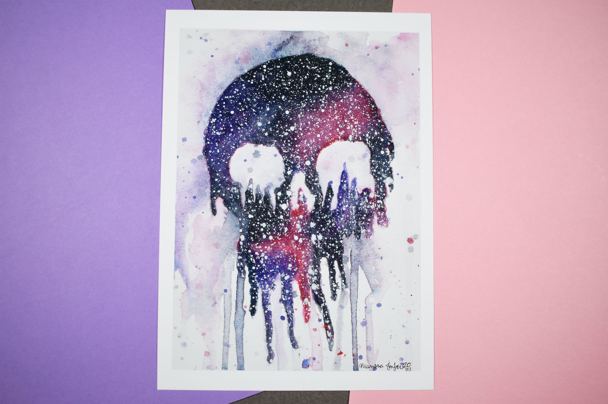 Watercolor painting of a skull with a colorful gradient on a white background