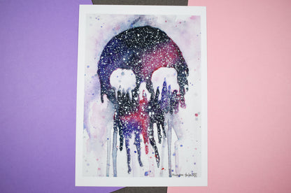 Watercolor painting of a skull with a colorful gradient on a white background